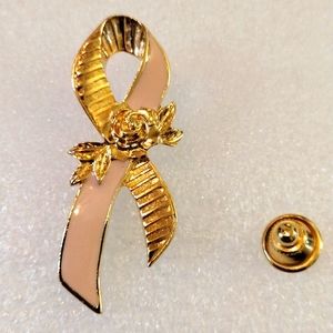 Avon cancer awareness pink ribbon brooch.